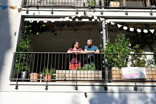Temperli and his girlfriend on the balcony of their cluster flat.