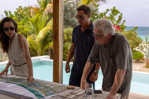 Goodfella in paradise: Project manager Katy Horne, developer Daniel Shamoon and Robert De Niro examine a resort map.