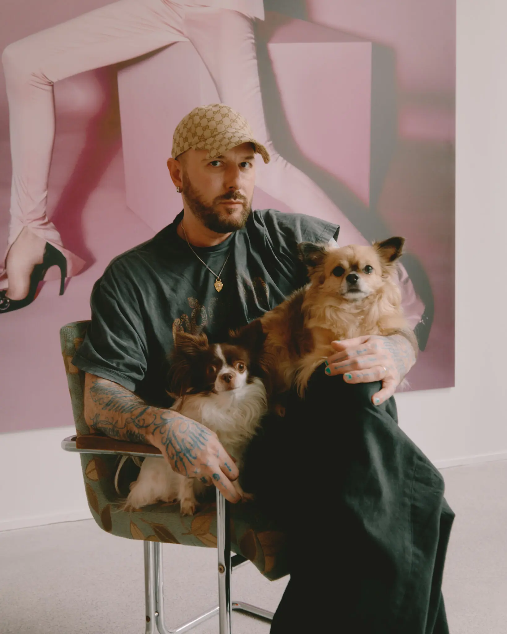 Demna in his new office at Gucci headquarters with his Chihuahuas, Chiquita, left, and Cookie. 