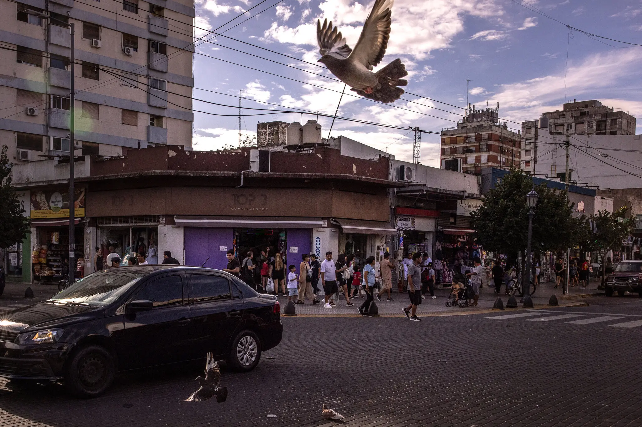 Pedestrians and clients walk through an Andean market in the Liniers section of Buenos Aires in February. The neighborhood is an immigrant hub.