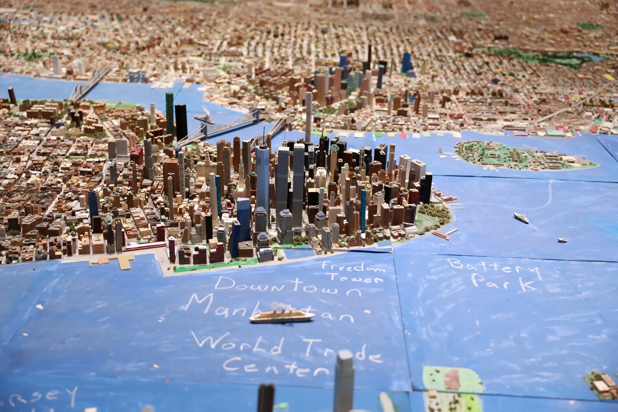 Joe Macken’s miniature model of New York City includes intentional anachronisms, such as the coexistence of the World Trade Center, which was destroyed in the 9/11 attacks, and its successor, One World Trade Center.