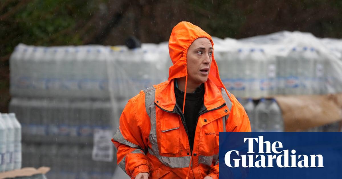 South East Water staff handing out bottled water in East Grinstead, West Sussex, on Tuesday.