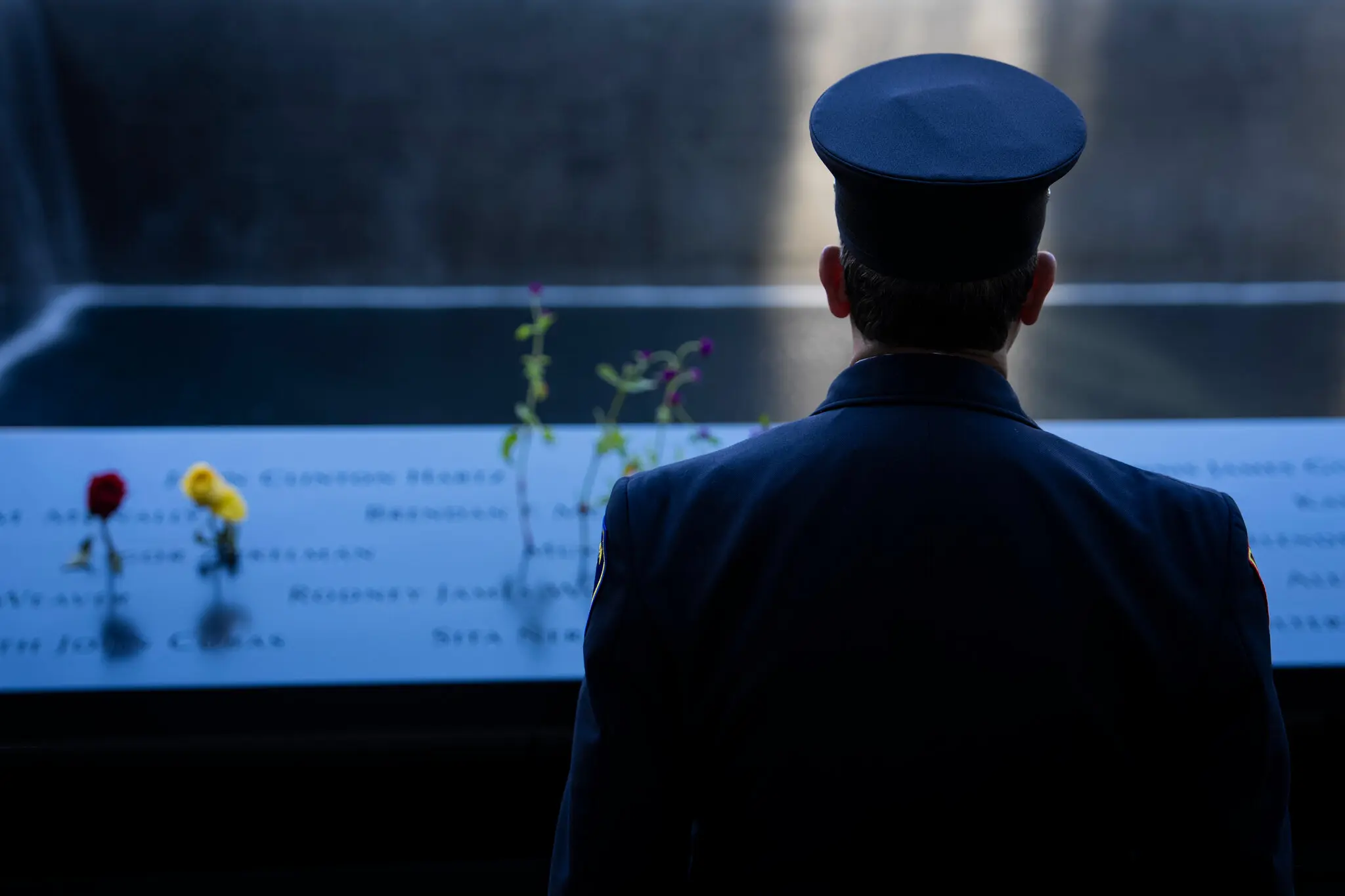 James Hagan, a volunteer firefighter who lost his sister on Sept. 11, 2001, looking at the World Trade Center memorial in Manhattan last year.