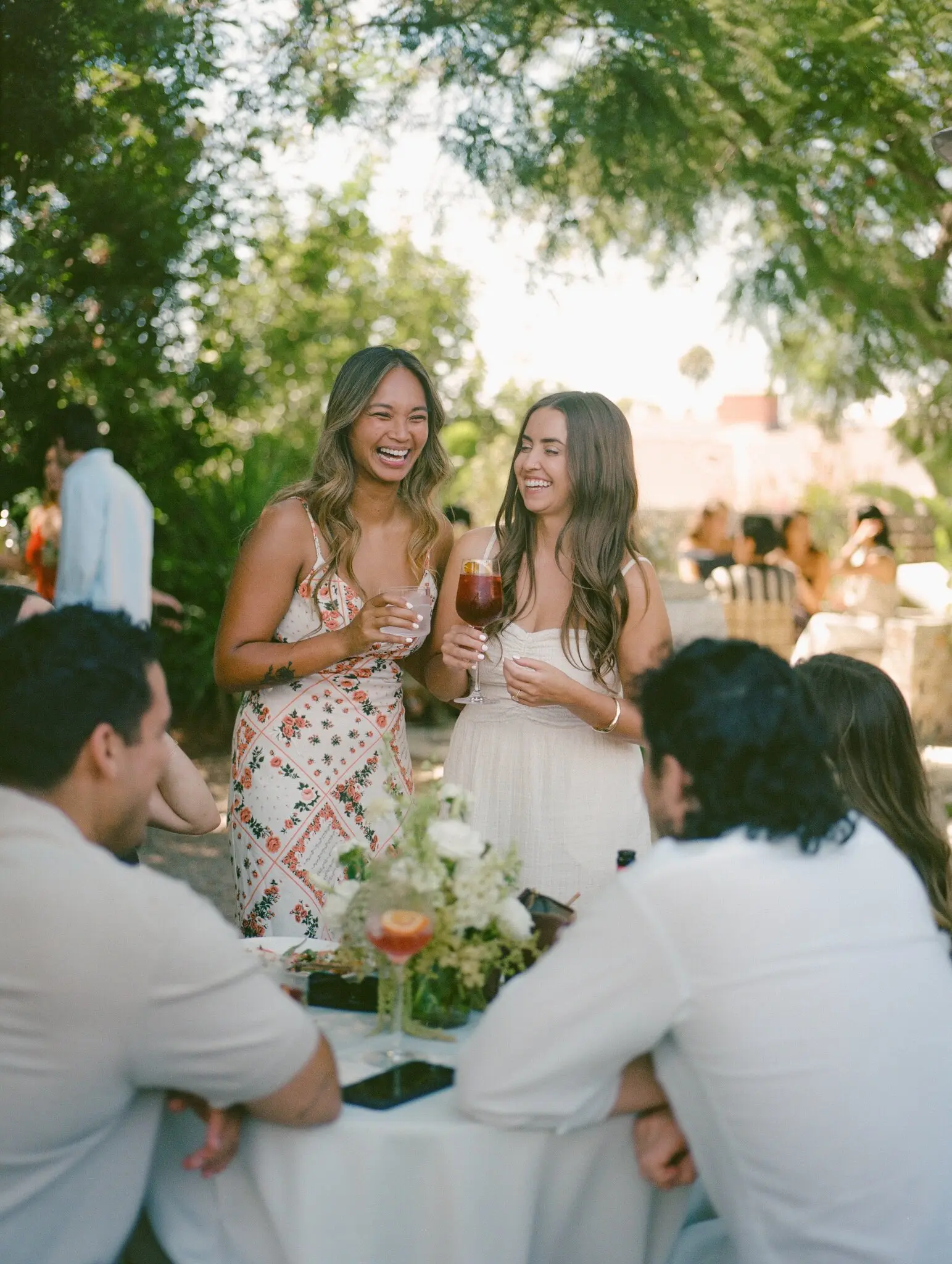 Jezzel Viray, left, and Morgan Yates hosted a party in the backyard of their Los Angeles home last summer with a Spanish theme. They will marry in Mallorca, Spain, in July.