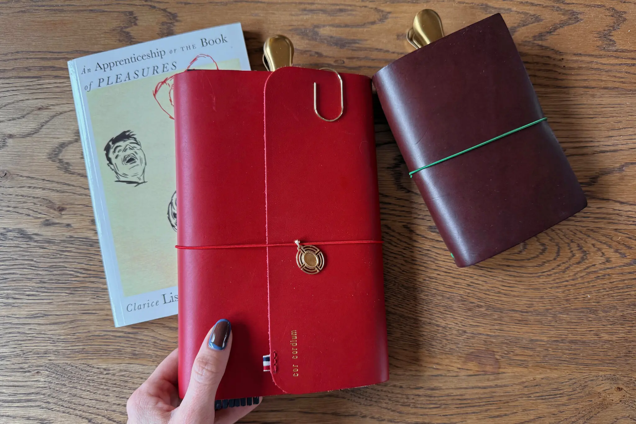 Louise Carmen notebooks, like Lindsey Nguyen’s red-leather version, middle, can be personalized in several ways.