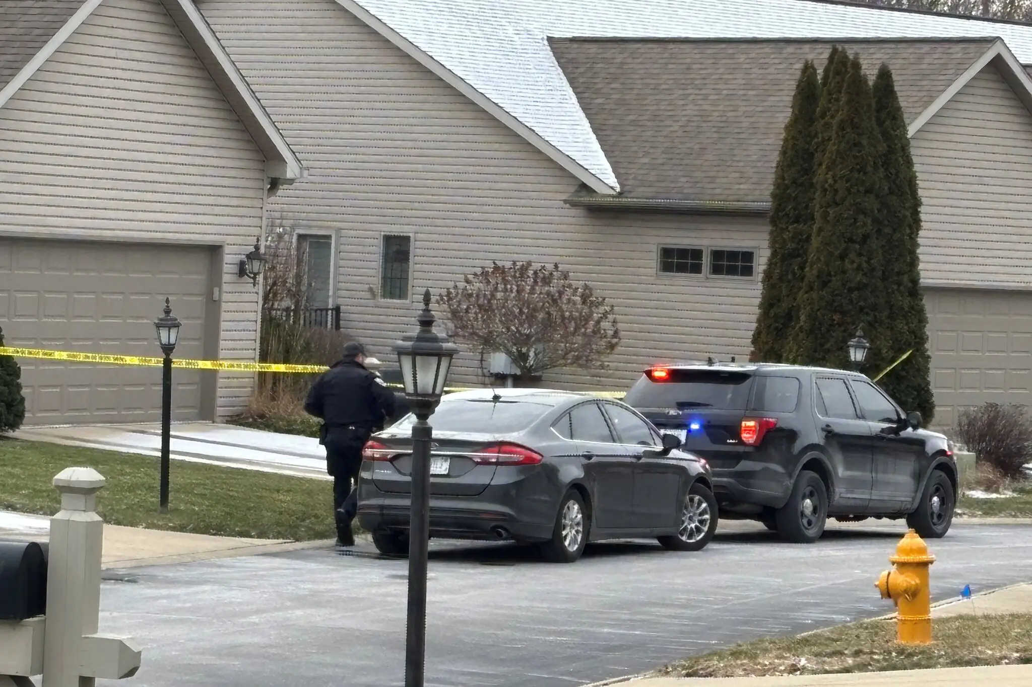 Police officers outside the home of Judge Steven Meyer and his wife, Kim, in Lafayette, Ind., on Sunday.