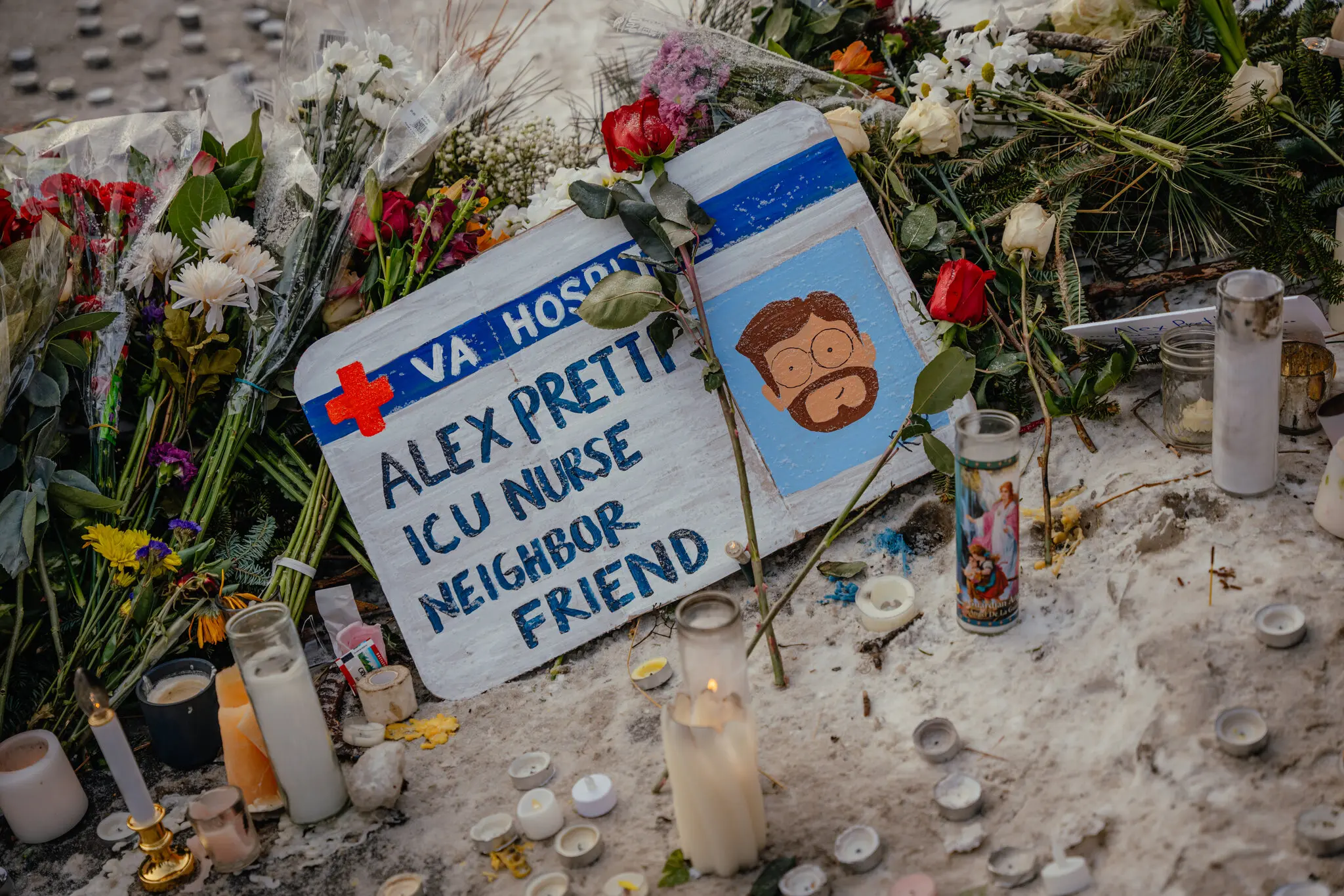 A handmade sign memorializes Alex Pretti, who was shot and killed by immigration agents on Saturday in Minneapolis.
