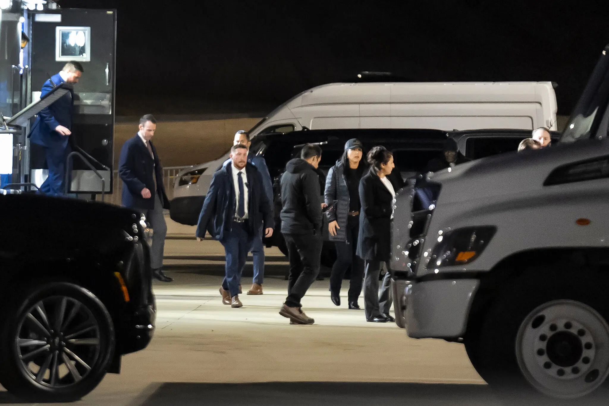 The director of national intelligence, Tulsi Gabbard, wearing a coat and dark cap, at the Fulton County elections office in Fairburn, Ga., last week.