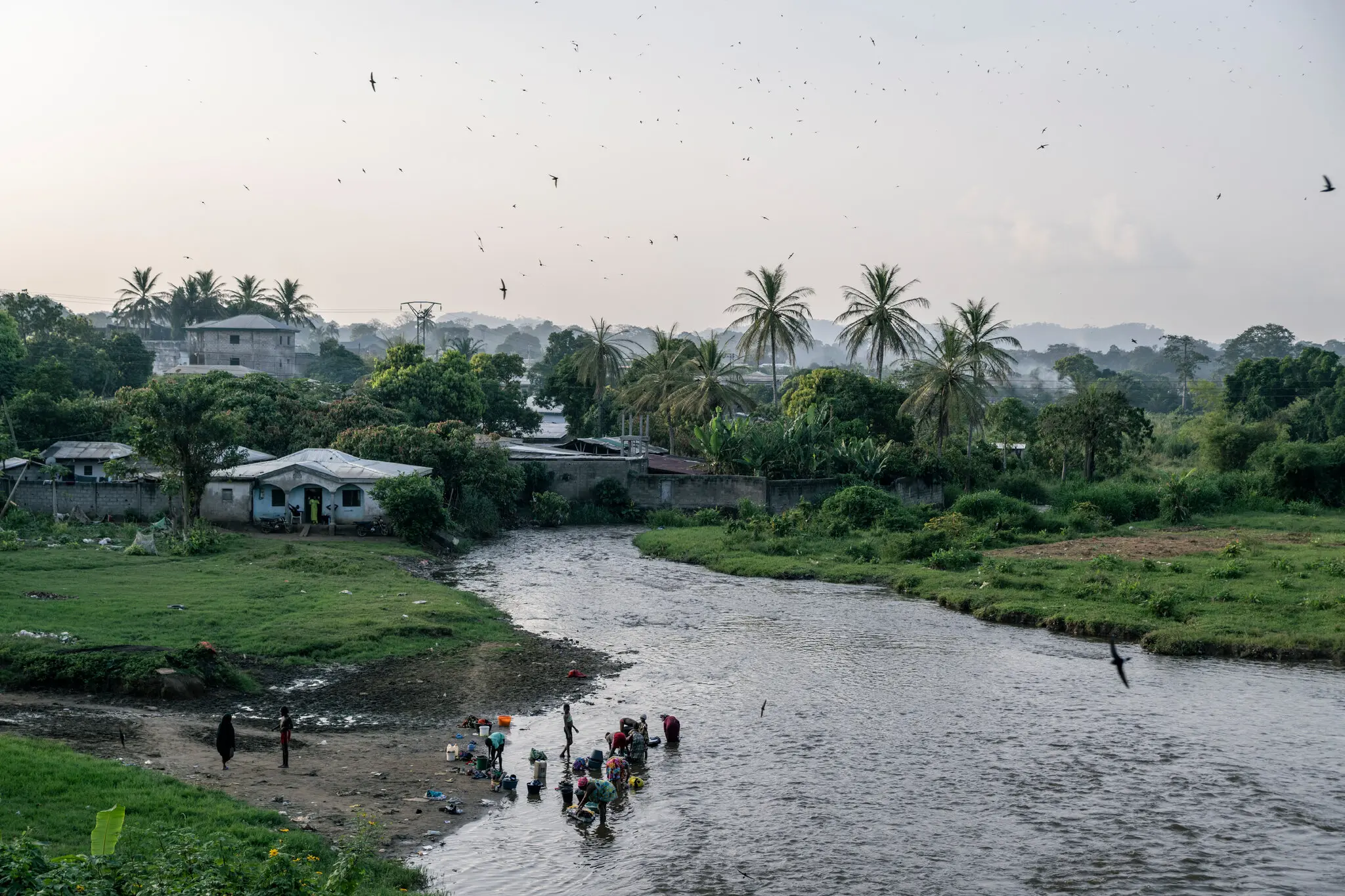 Laundry and bathing in the Afamba River, which flows through Obala, in central Cameroon, where a U.S.-funded neglected tropical disease treatment program was halted.