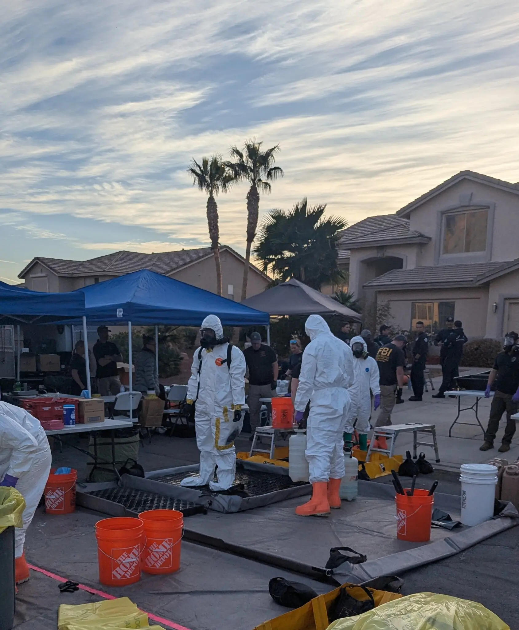 Federal agents outside a home where a potential biological lab was discovered in Las Vegas. Investigators found lab equipment and vials containing unknown liquids.