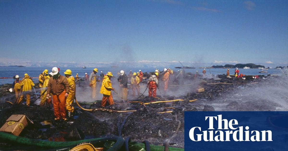 Teams of firefighters cleaning the Alaskan coast after the 1989 Exxon Valdez oil spill.