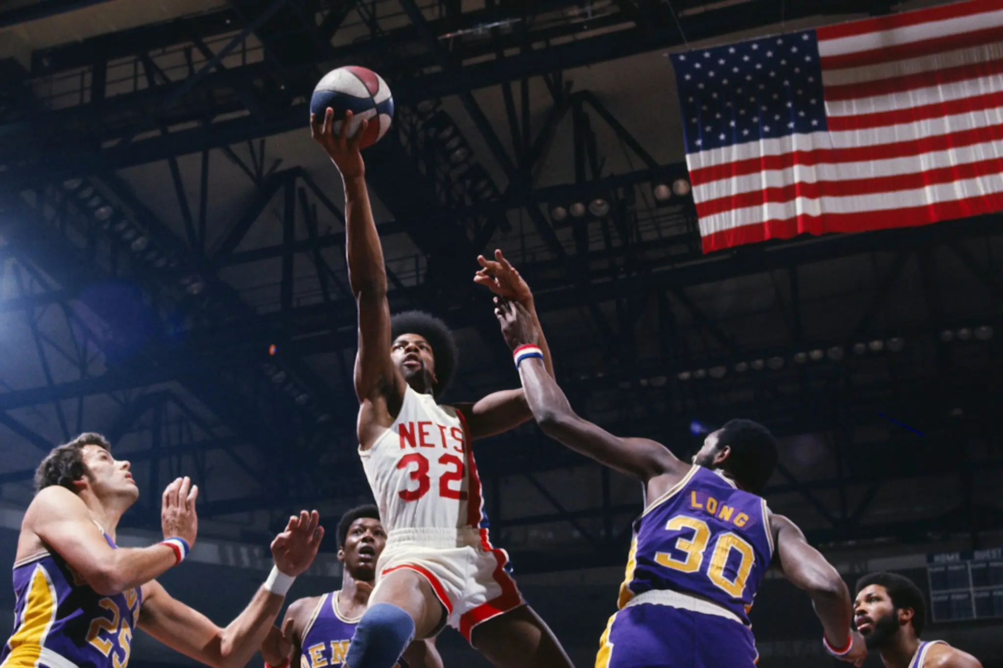 Julius Erving, middle, known as Dr. J., as seen in “Soul Power: The Legend of the American Basketball Association,” a four-part documentary by Kenan Kamwana Holley.