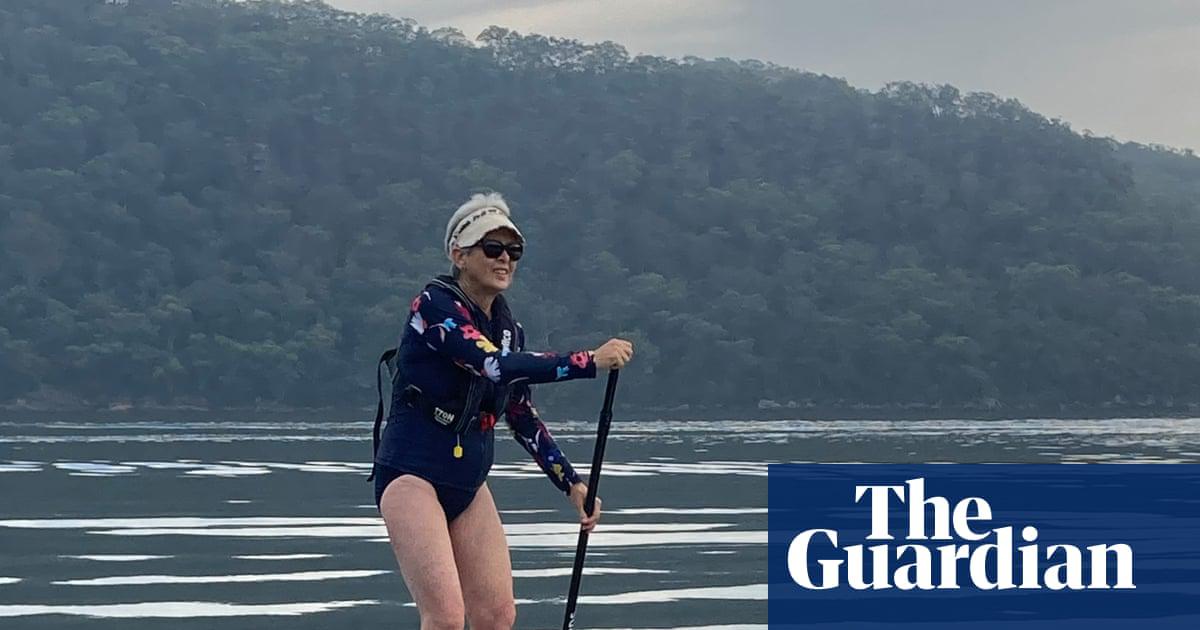 ‘The sun is shining and the early morning light glints across the calm waters of the Hawkesbury. It’s time to get my paddleboard out’: Joanne Karcz on her paddleboard.