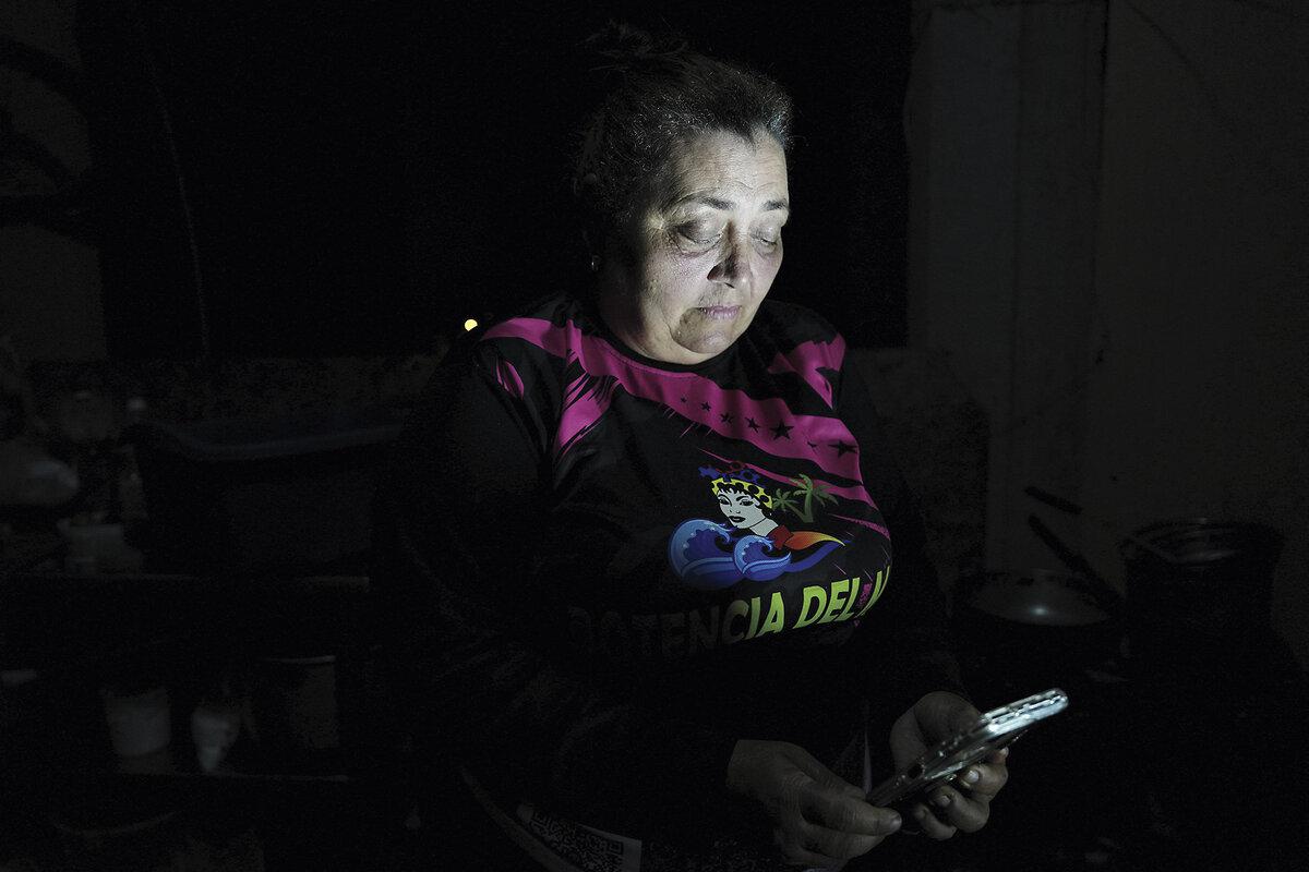 Venezuelan migrant Janeth Ferren makes an internet call from Lima, Peru, to her brother in Maracaibo, Venezuela, after the United States launched a strike on Venezuela and captured President Nicolás Maduro and his wife, Jan. 10, 2026.