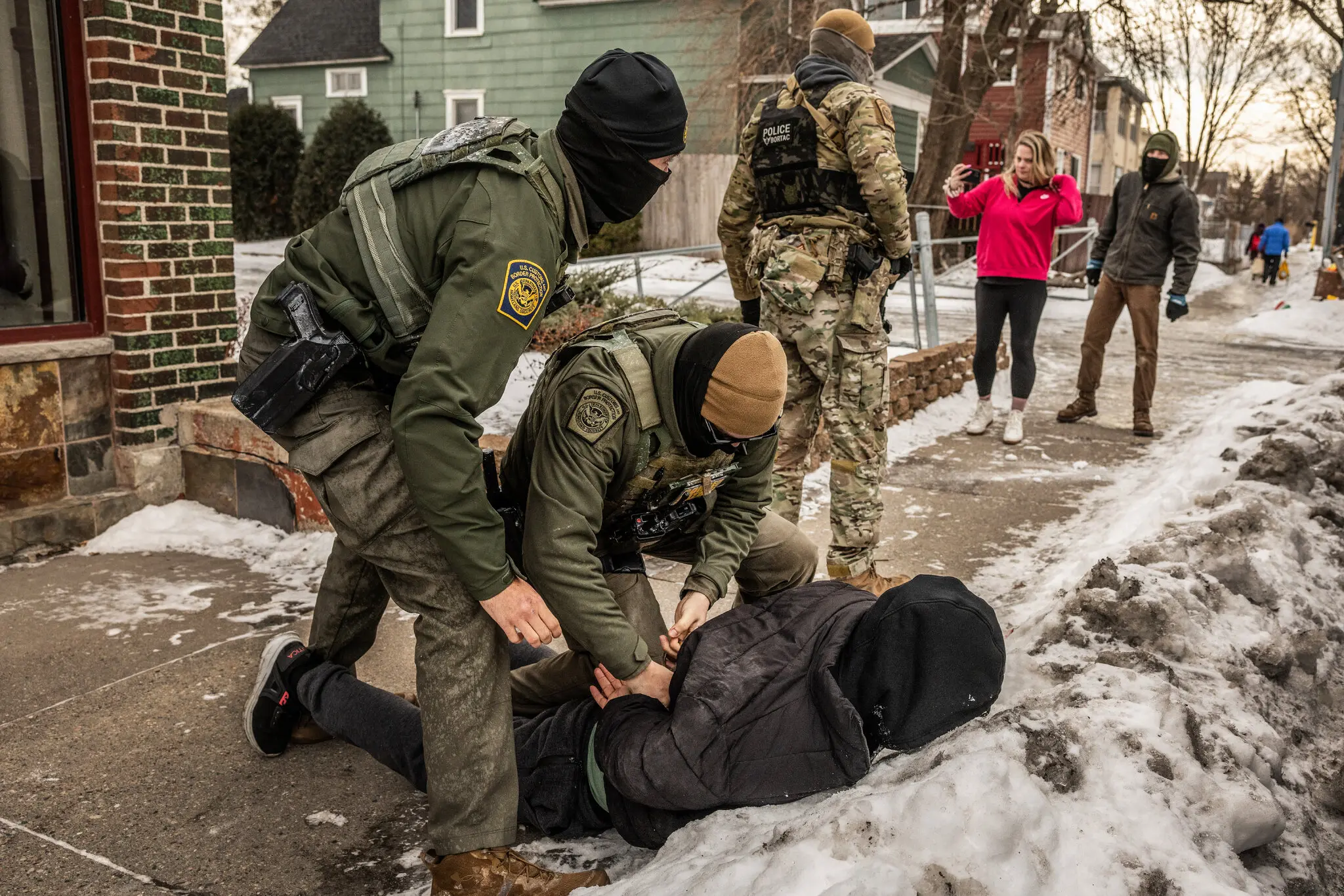 Federal agents arresting an unidentified man in Minneapolis last month.