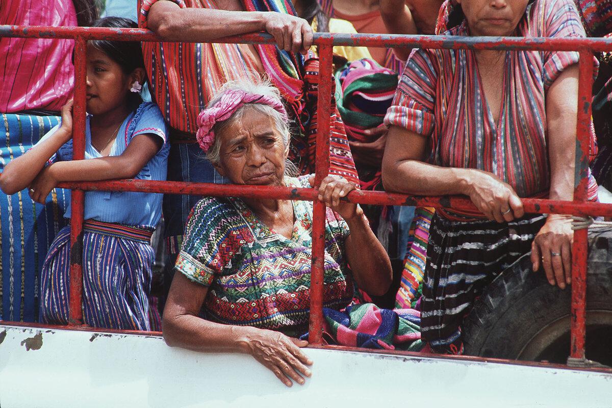 Indigenous Guatemalans, clad in traditional tunics known as huipils, crowd into the back of a truck in San Lucas Tolimán, Guatemala, in 1989.