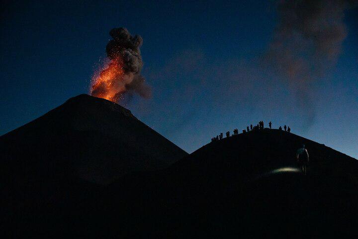 From the heights of Acatenango Volcano, in Guatemala, hikers are granted a close-up view of the erupting Volcán de Fuego, witnessing its overwhelming power as lava and ash paint the sky.